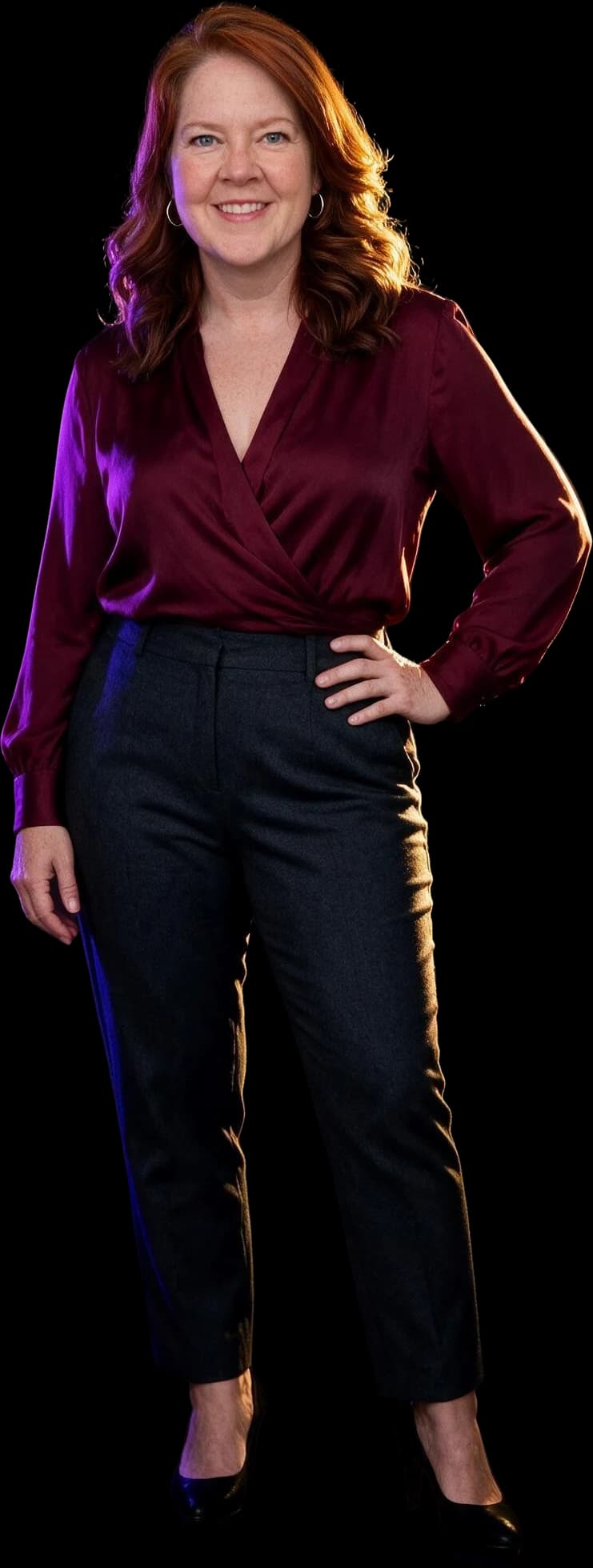 Michelle Anderson standing, lit by violet and gold light